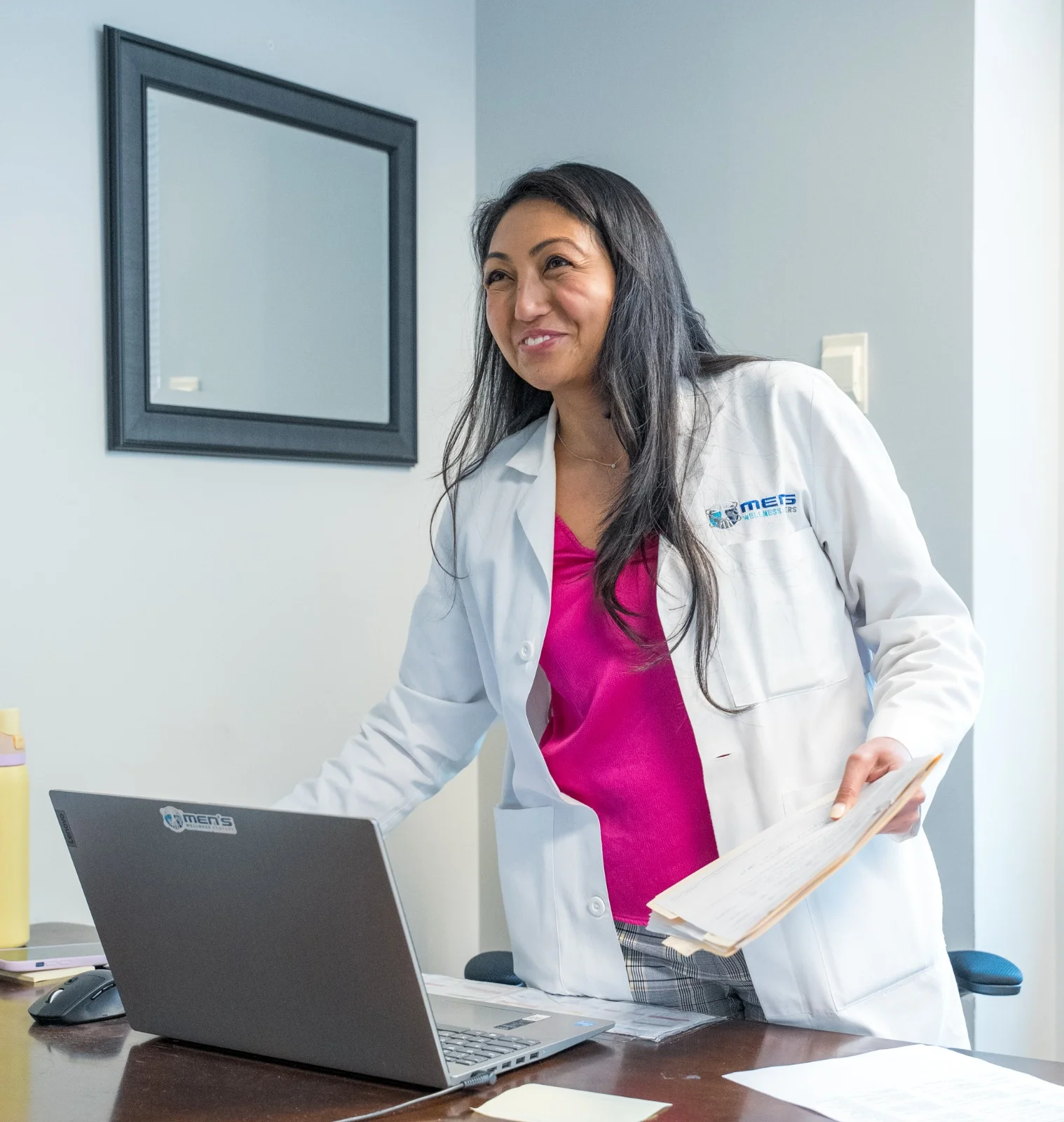 Provider reviewing weight loss protocol with member at Men's Wellness Centers